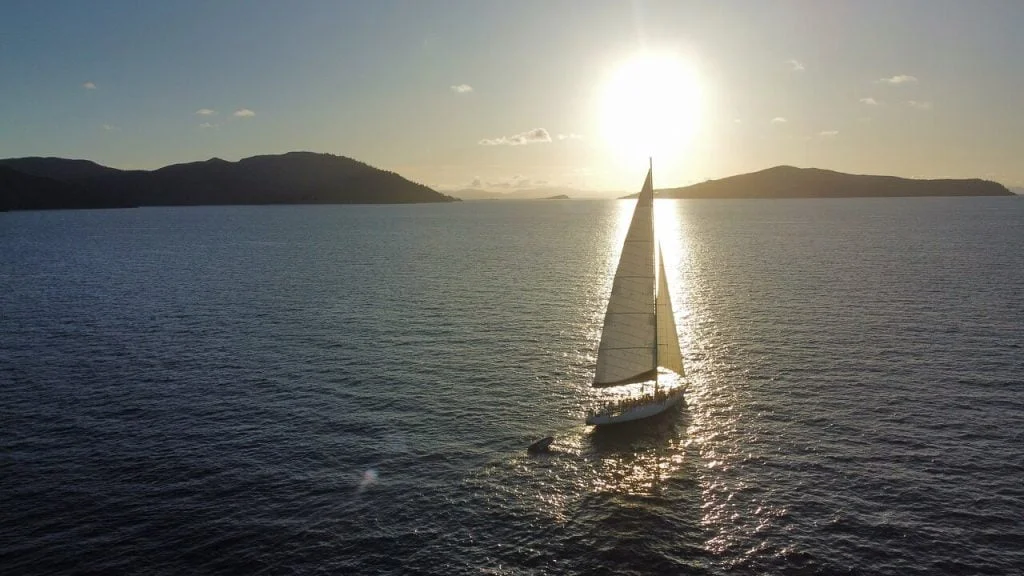 Spank Me Whitsundays at sunset sailing the islands