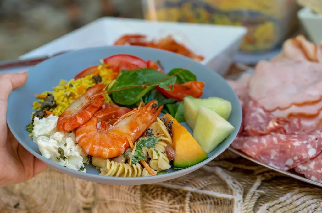Lunch on the tour, prawns salads and meats on a plate