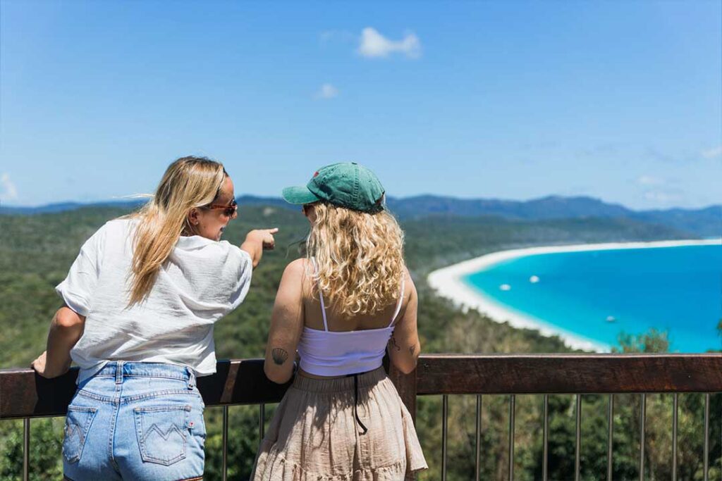 2 Ladies at South Whitehaven Lookout platform overlooking all 7km of Whitehaven Beach.