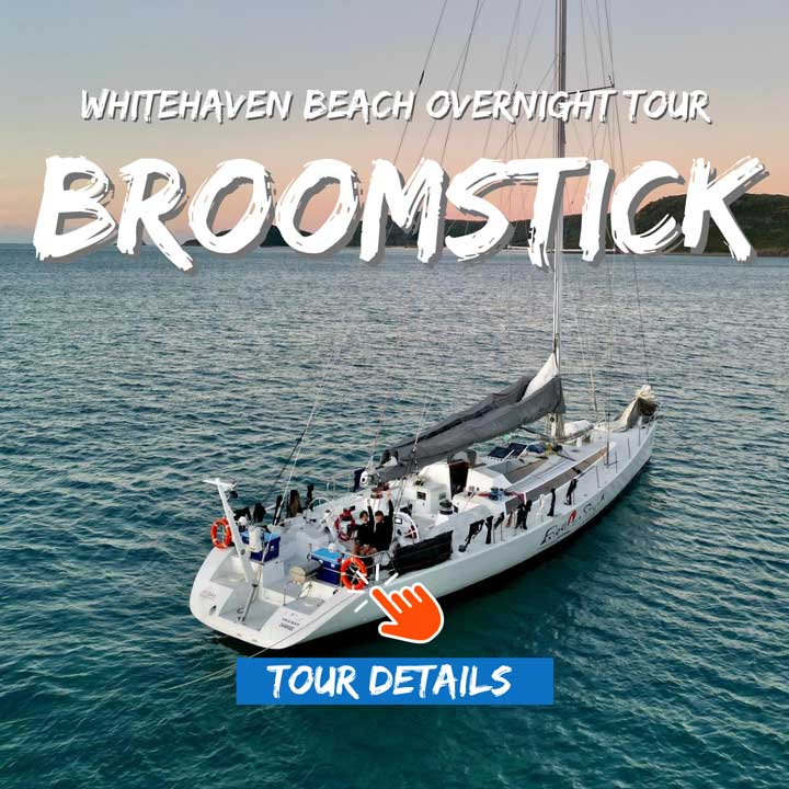 The yacht named Broomstick anchored in a bay in the Whitsunday Islands