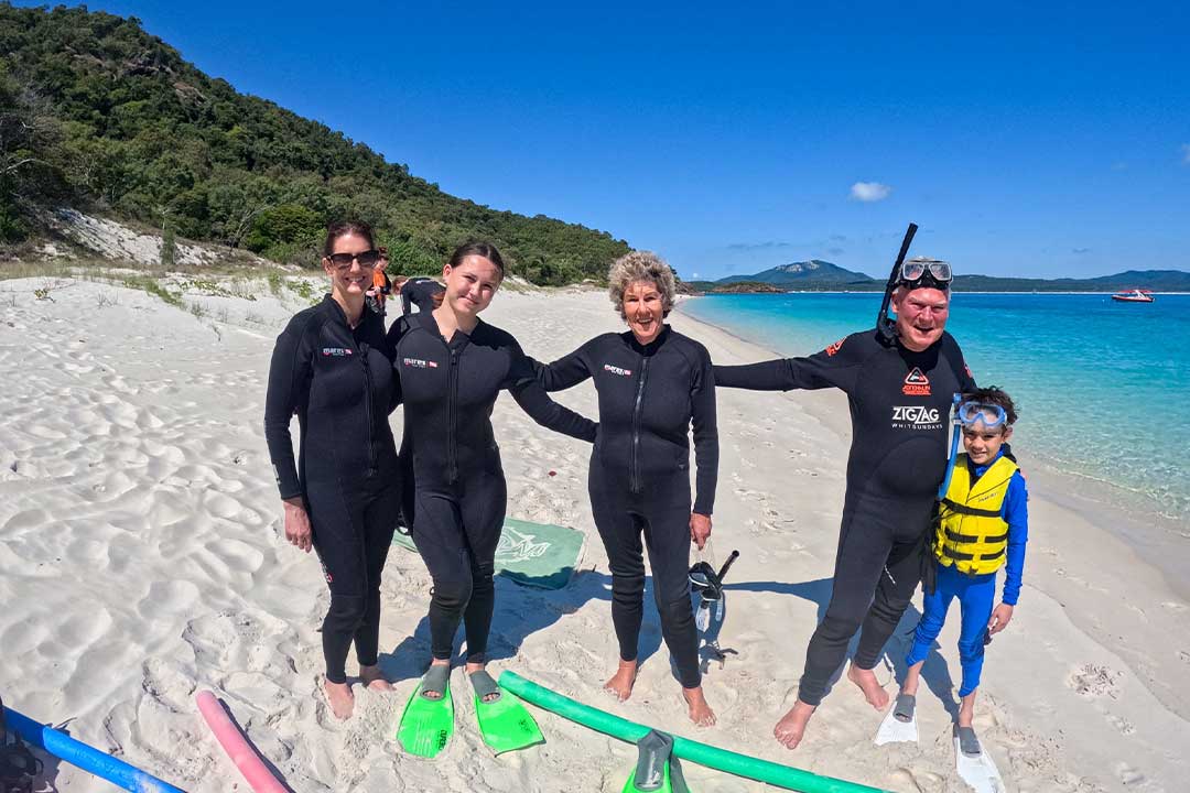 Family ready to snorkel the coral reef at Chalkies Beach